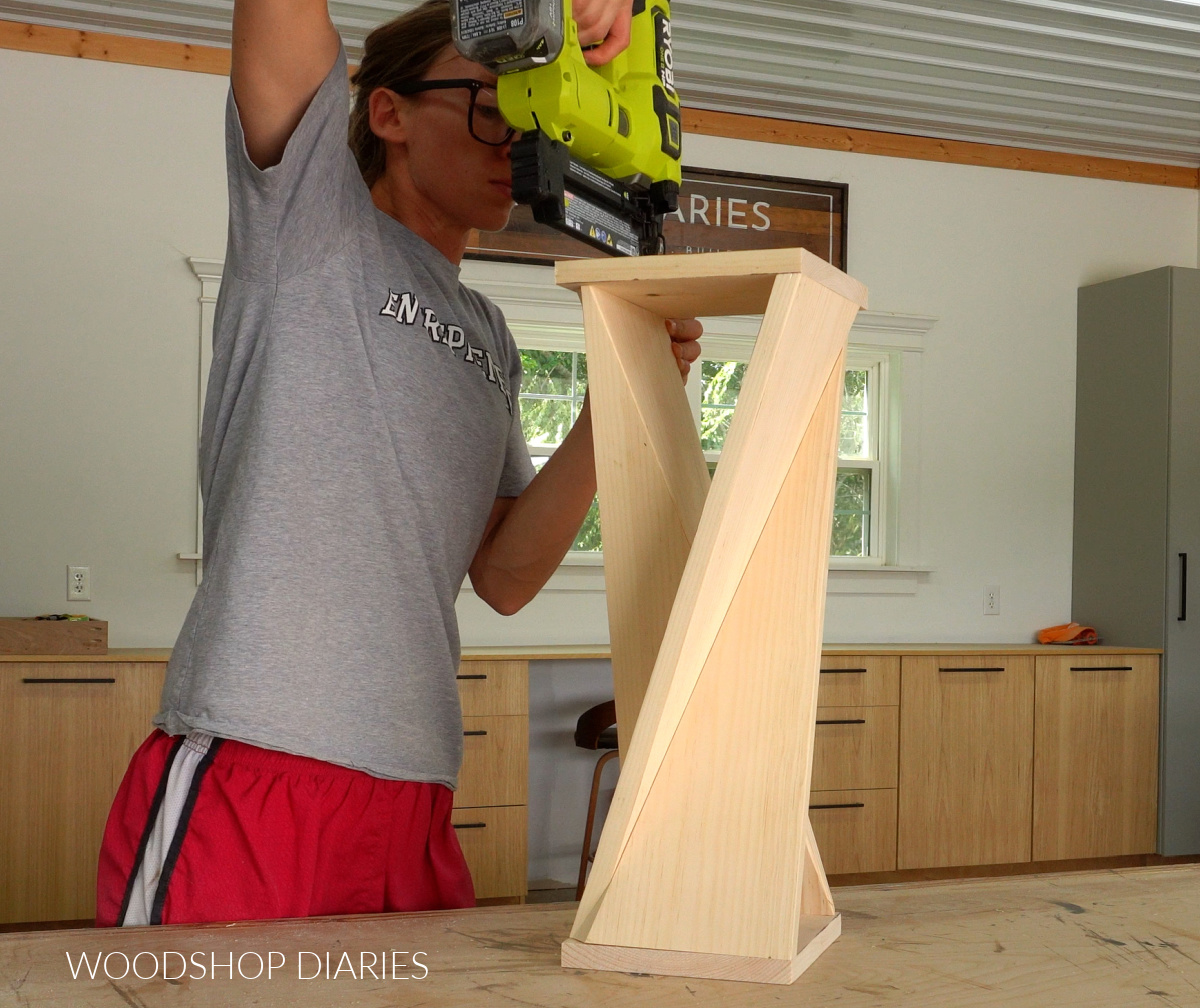 Shara Woodshop Diaries nailing top and bottom onto twisty table project