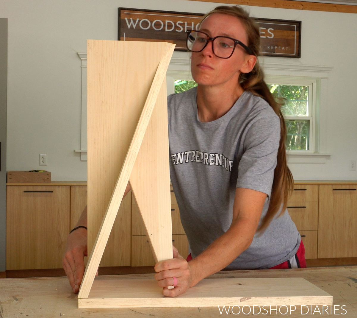 Shara Woodshop Diaries test fitting twisted table legs together on 1x8 board
