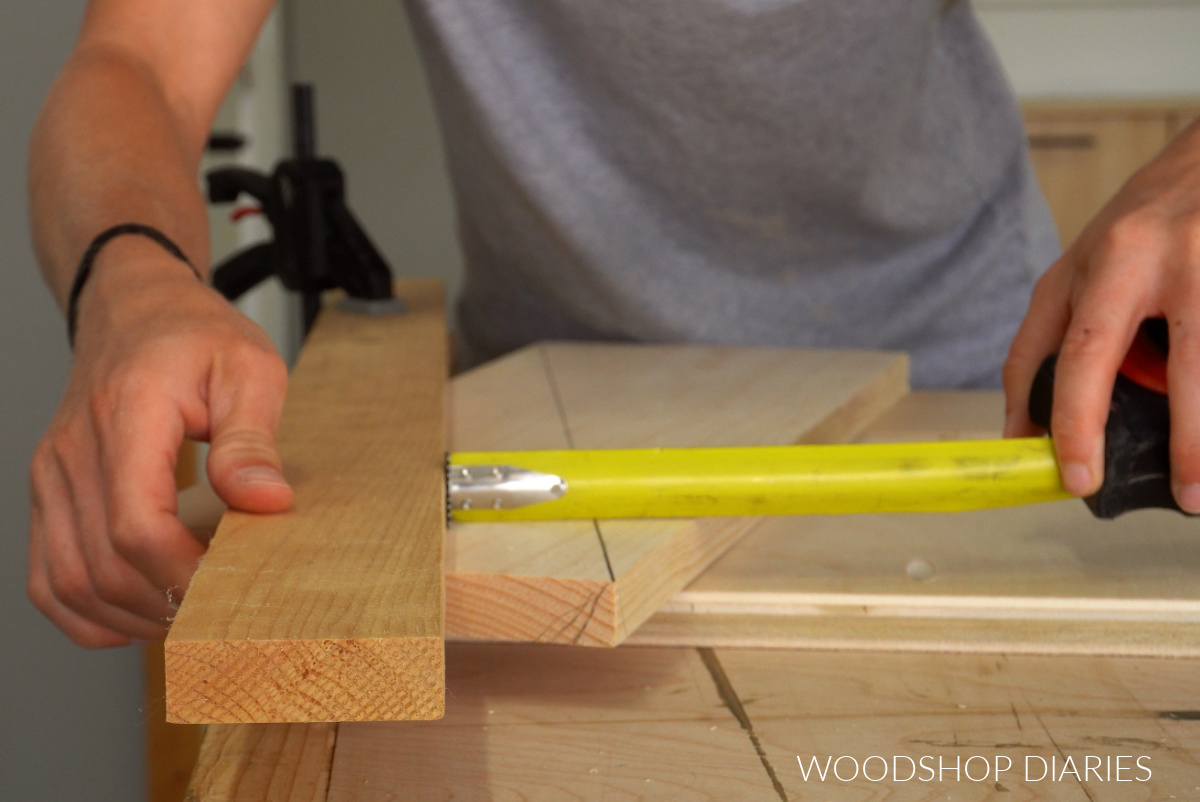 Shara Woodshop Diaries measuring straight edge placement to cut twisty table legs