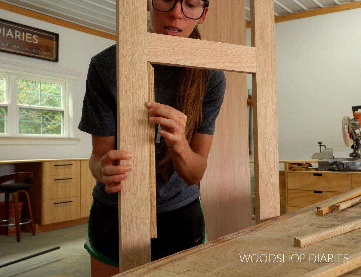 Shara Woodshop Diaries demonstrating how trim pieces will line inside of door frame openings