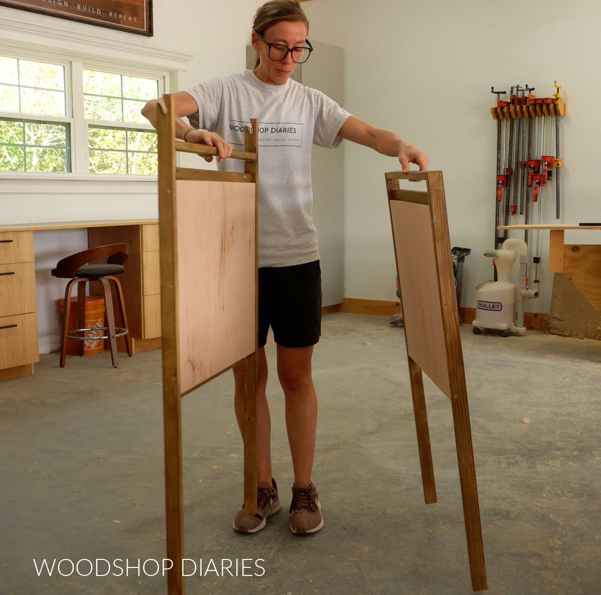 Two frames of art easel with chalkboards installed ready to attach