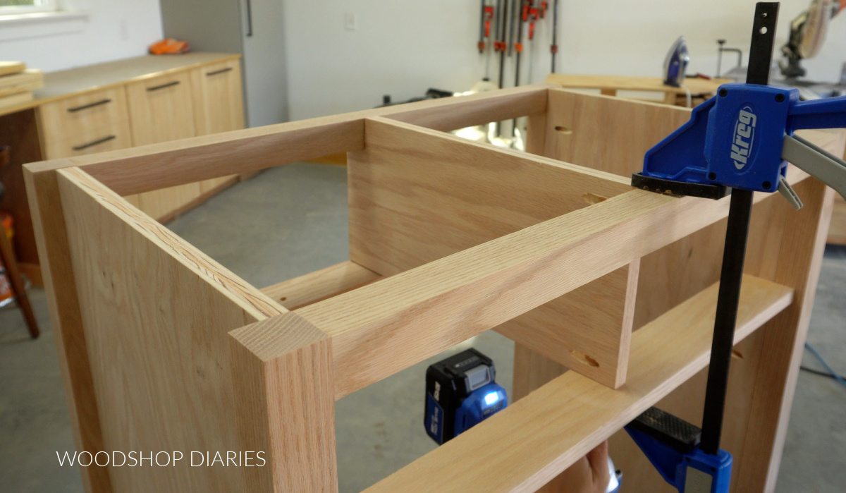 Close up of drawer divider clamped into dresser frame