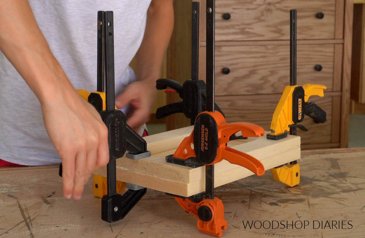 Shara Woodshop Diaries clamping glued catch all tray boards together on workbench
