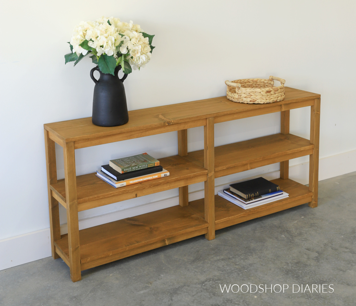 Completed wooden sofa console table with open shelving