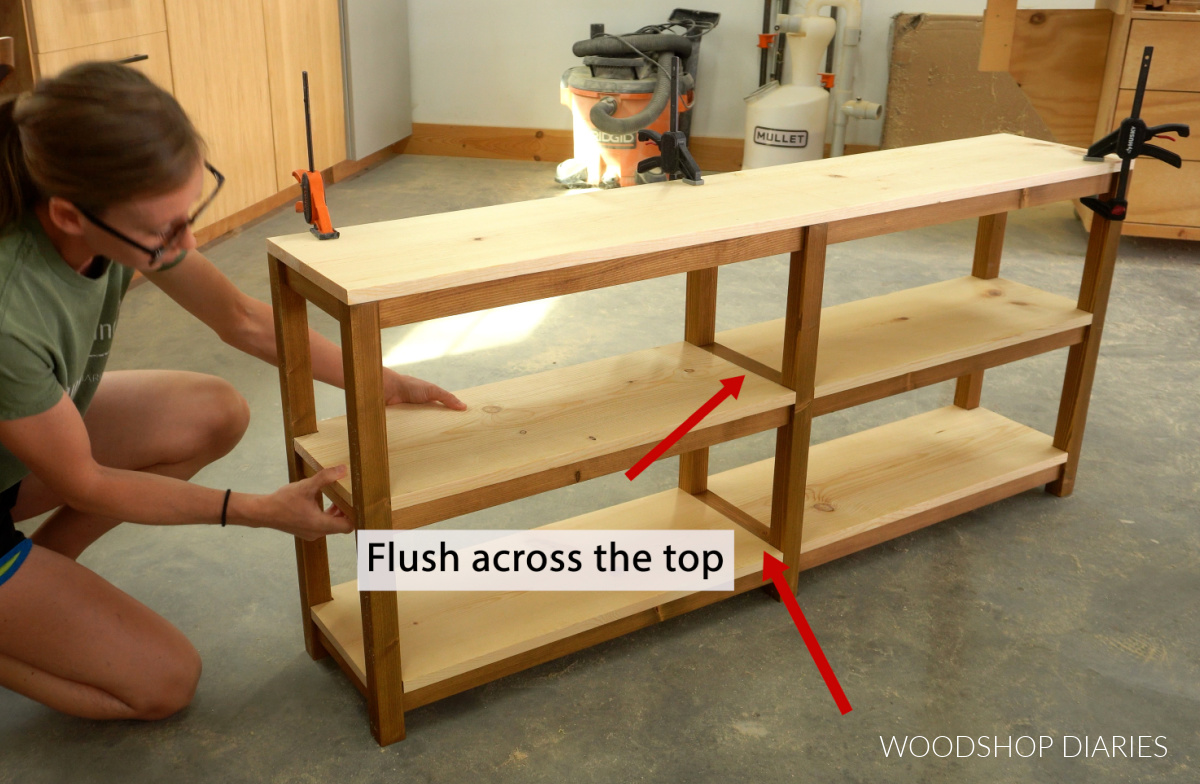 Shara Woodshop Diaries test fitting shelves on console base frame
