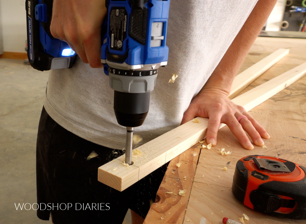 Drilling holes for paper roll holder in easel frame legs