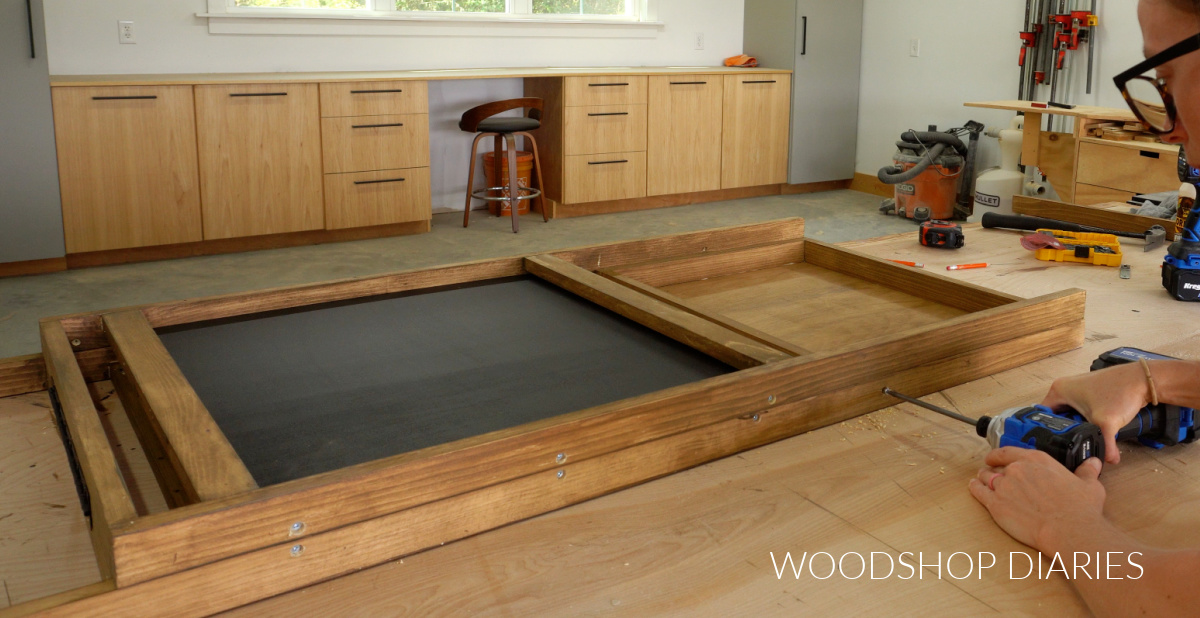 Shara Woodshop Diaries securing tray through easel frame with screw