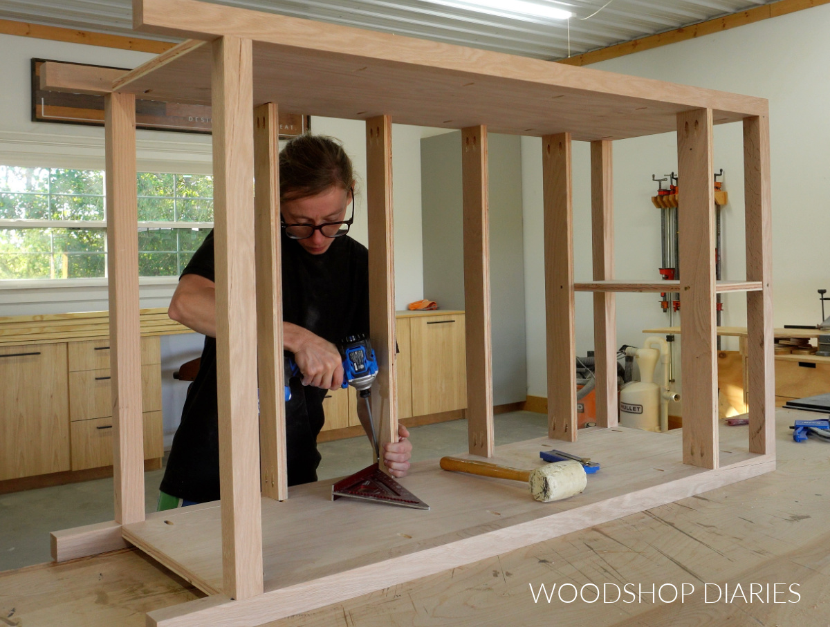 Shara Woodshop Diaries installing drawer dividers into chest frame using pocket hole screws