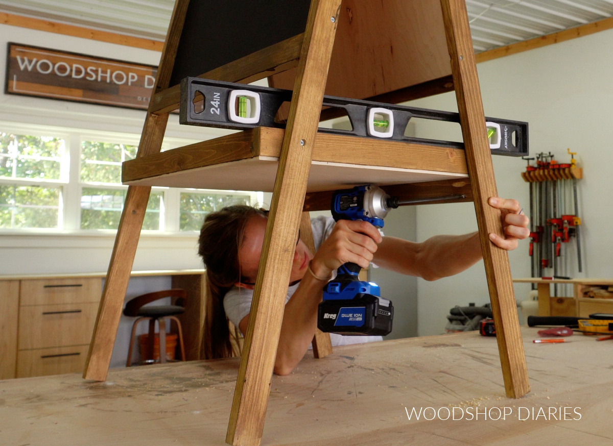 Shara Woodshop Diaries securing tray support into easel with pocket hole screws