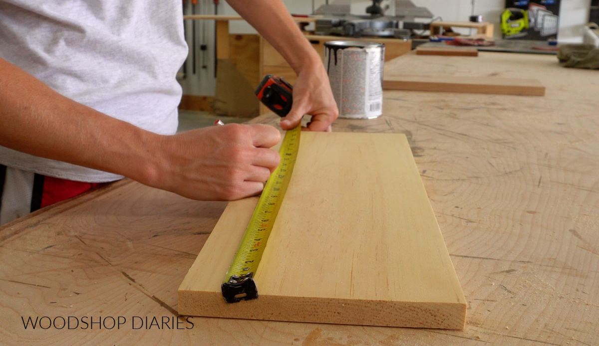 Shara Woodshop Diaries marking center of scrap board
