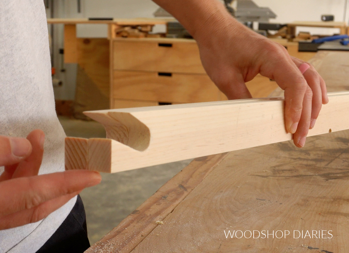 Close up of notches cut in easel frame legs for paper roll holder