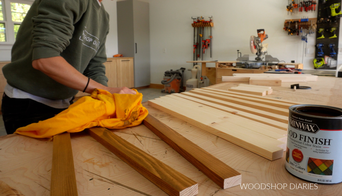 Shara Woodshop Diaries staining 1x2 boards on workbench