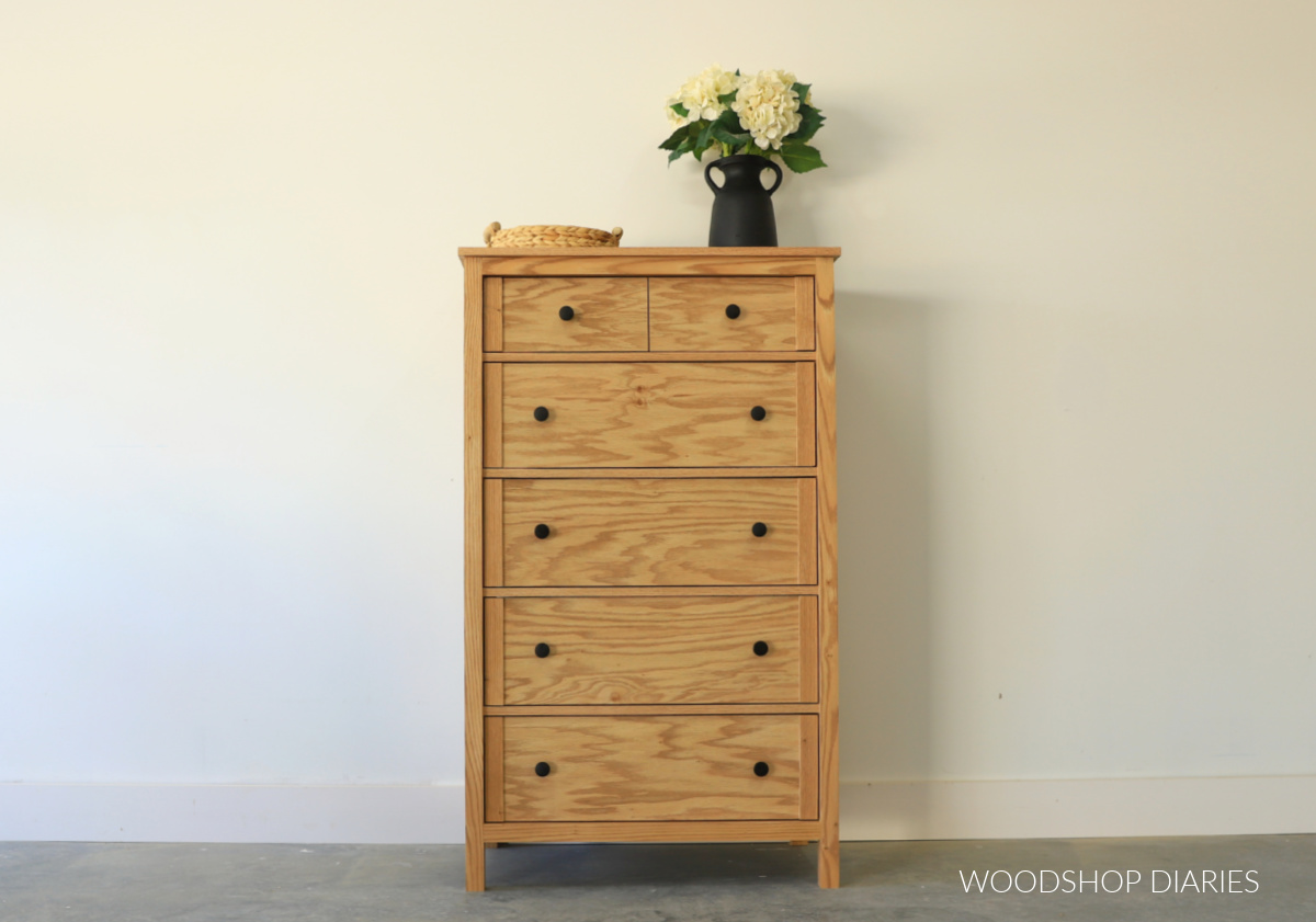 Front view of red oak tall dresser with two small drawers at top and four large drawers at bottom