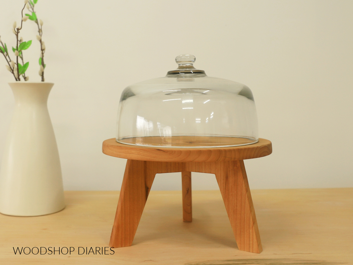 Modern wooden DIY cake stand with three legs and glass dome on top
