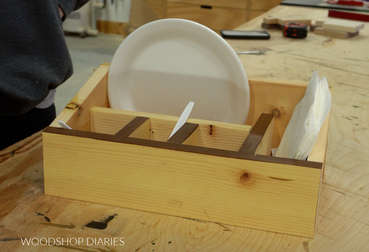 Test fitting dividers into wooden cutlery caddy before attaching