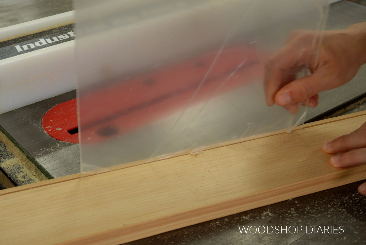 Shara Woodshop Diaries test fitting acrylic sheet into groove cut on 1x4 board