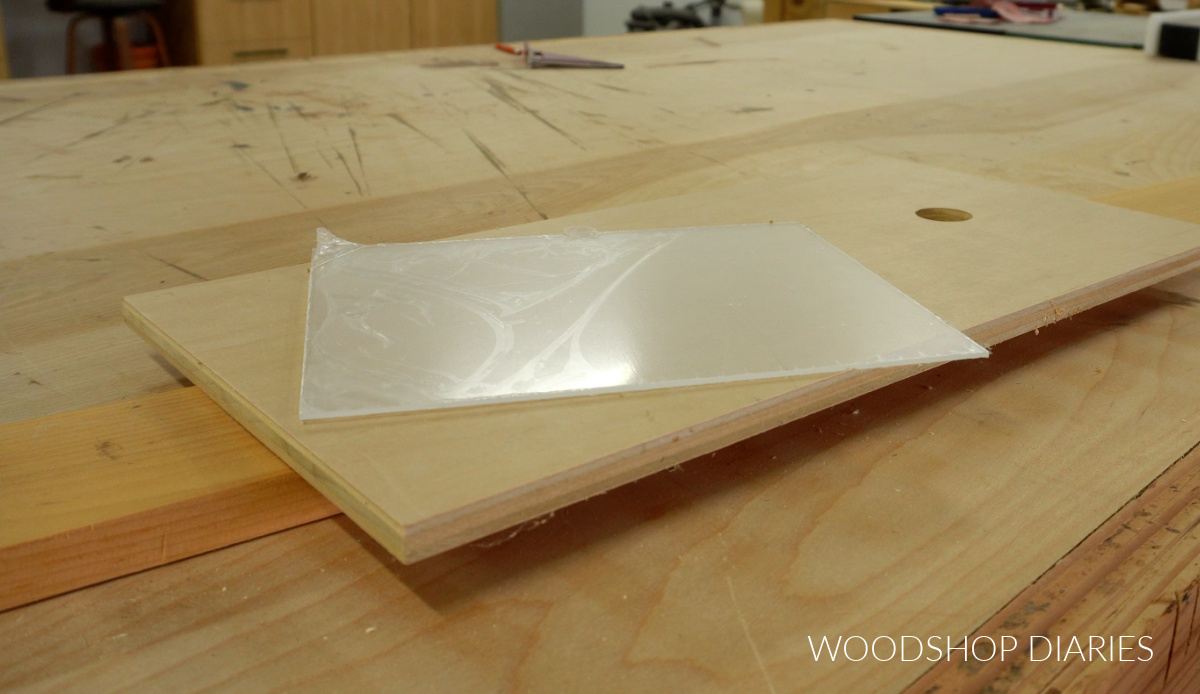 Materials needed for DIY shadow box on workbench