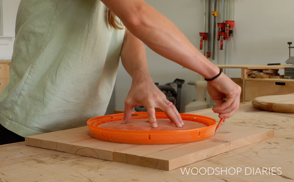 Shara Woodshop Diaries tracing 5 gallon bucket lid shape onto solid wood glued up panel