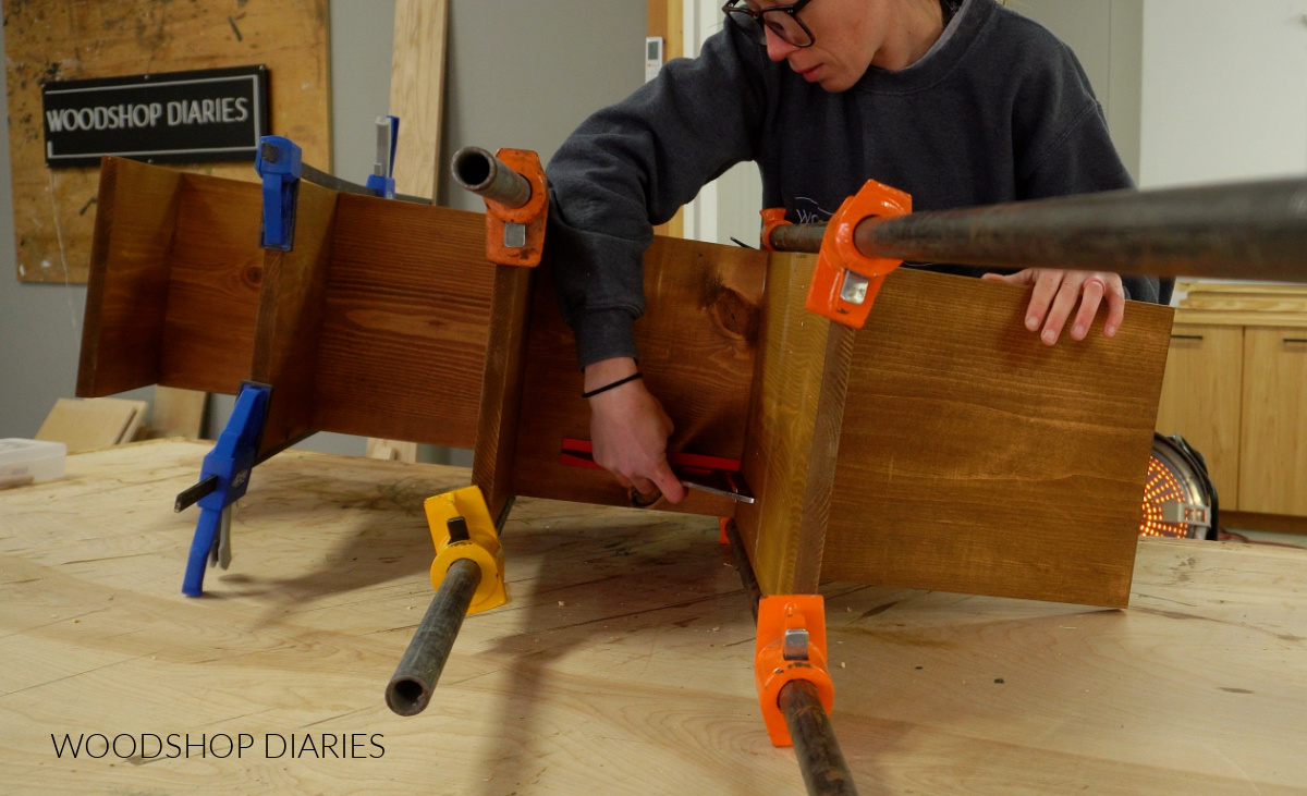 Shara Woodshop Diaries checking that boards are square on angled bookshelf build