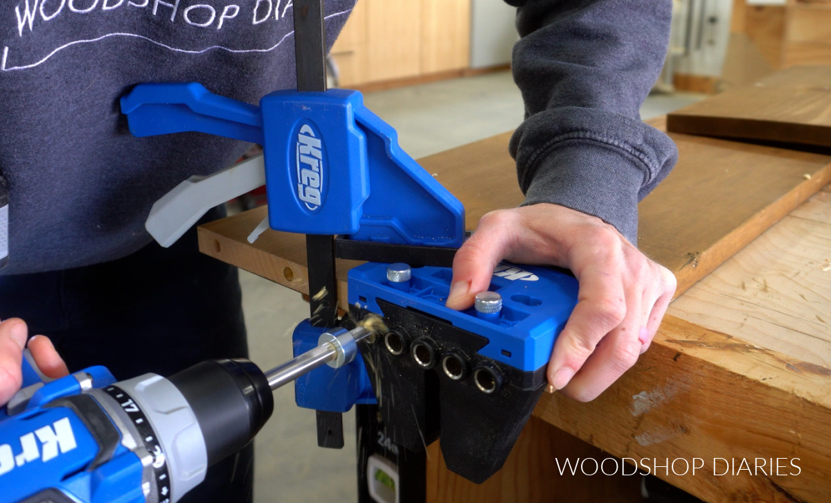 Shara Woodshop Diaries drilling dowel holes into end of 1x12 board with Kreg Doweling Jig