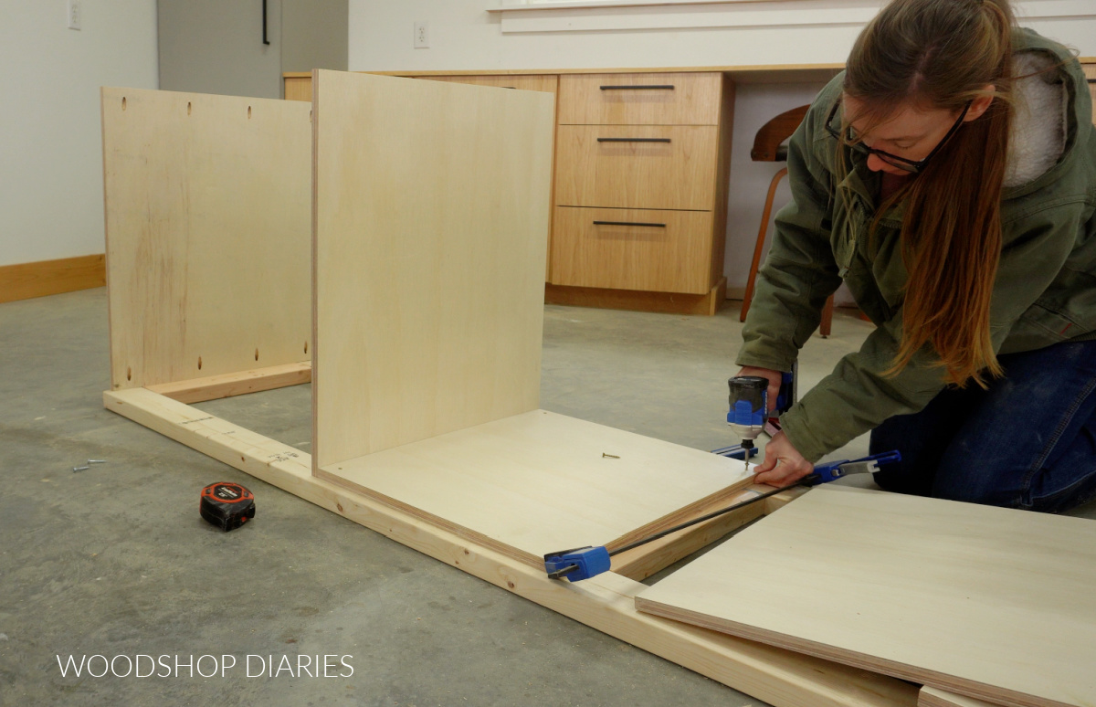 Shara Woodshop Diaries securing bottom panel into miter saw stand frame