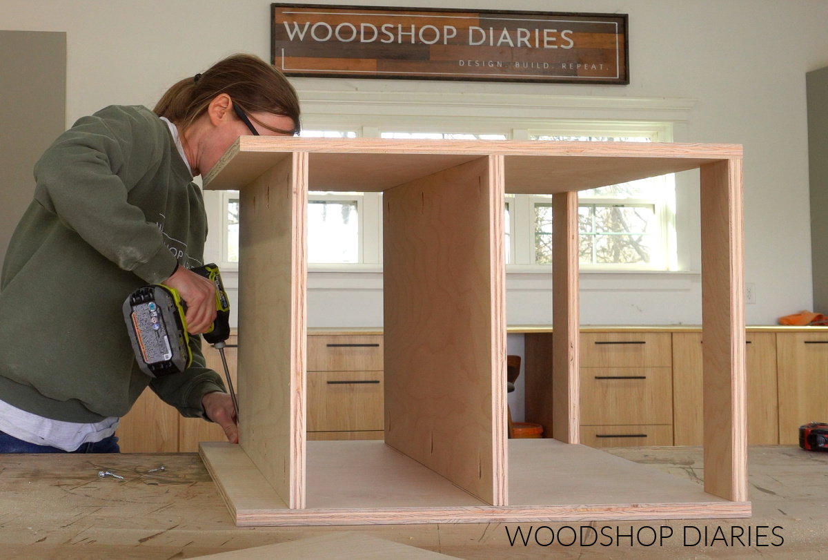 Shara Woodshop Diaries assembling part of TV stand console with pocket hole screws on workbench
