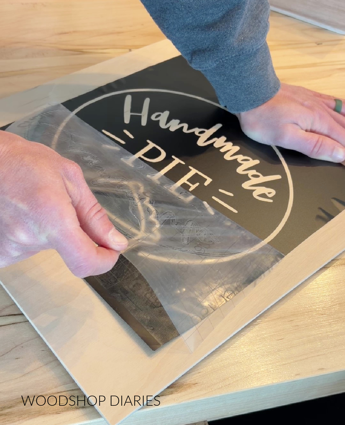 Shara Woodshop Diaries removing transfer tape from wooden pie box lid stencil