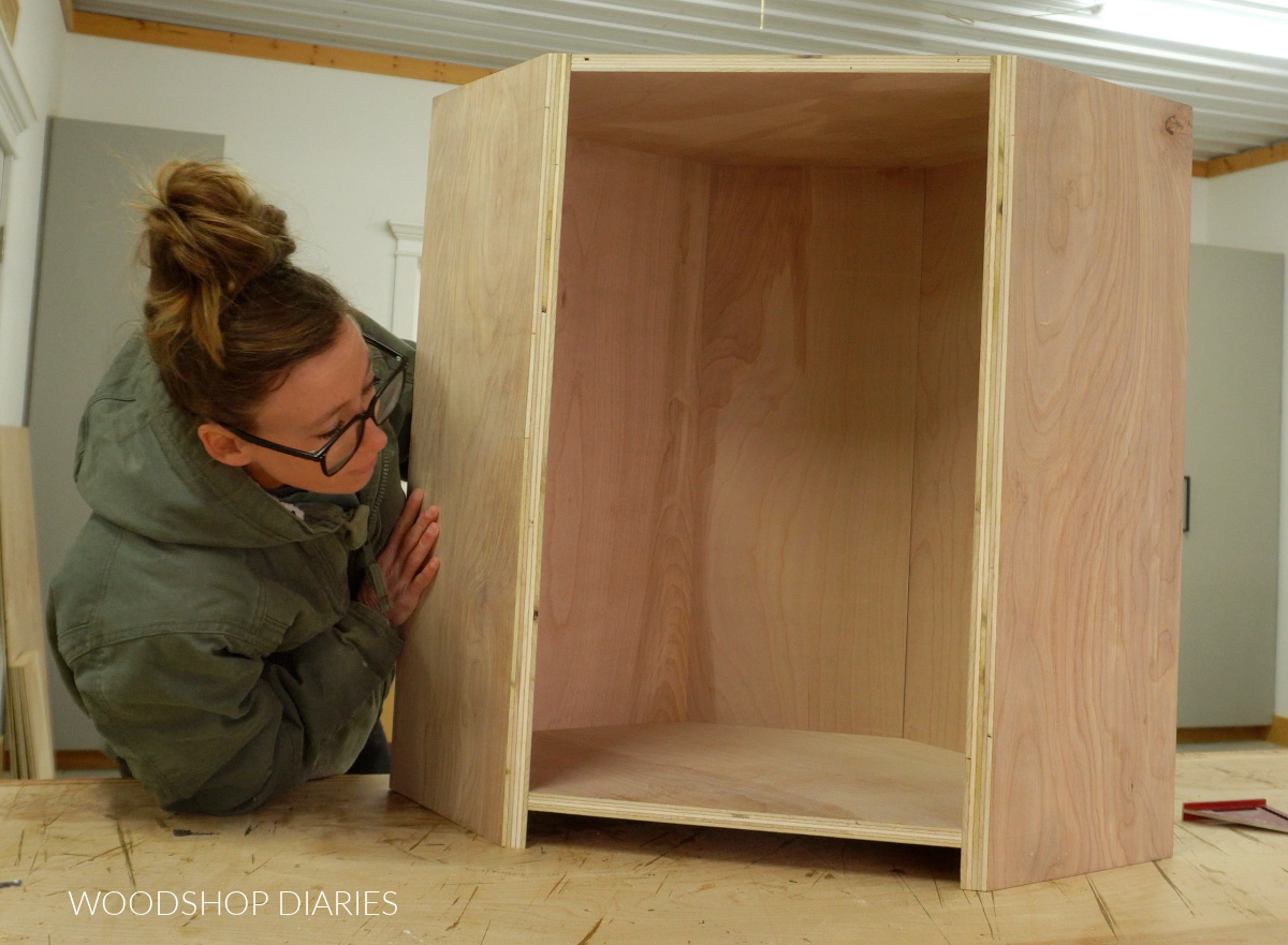 Completed DIY corner cabinet box assembled on workbench