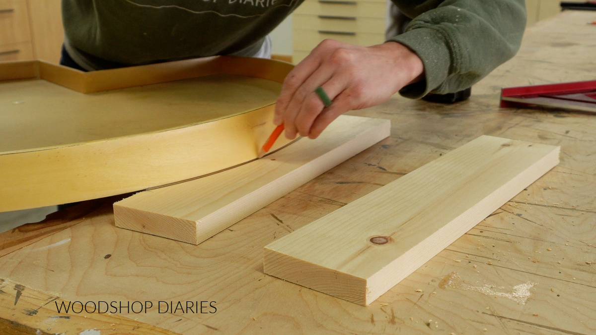Shara Woodshop Diaries tracing arch onto 1x4 for TV stand face frame