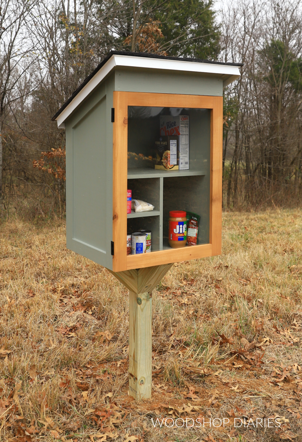 Free little pantry build--pantry installed onto post supports with door closed and latched