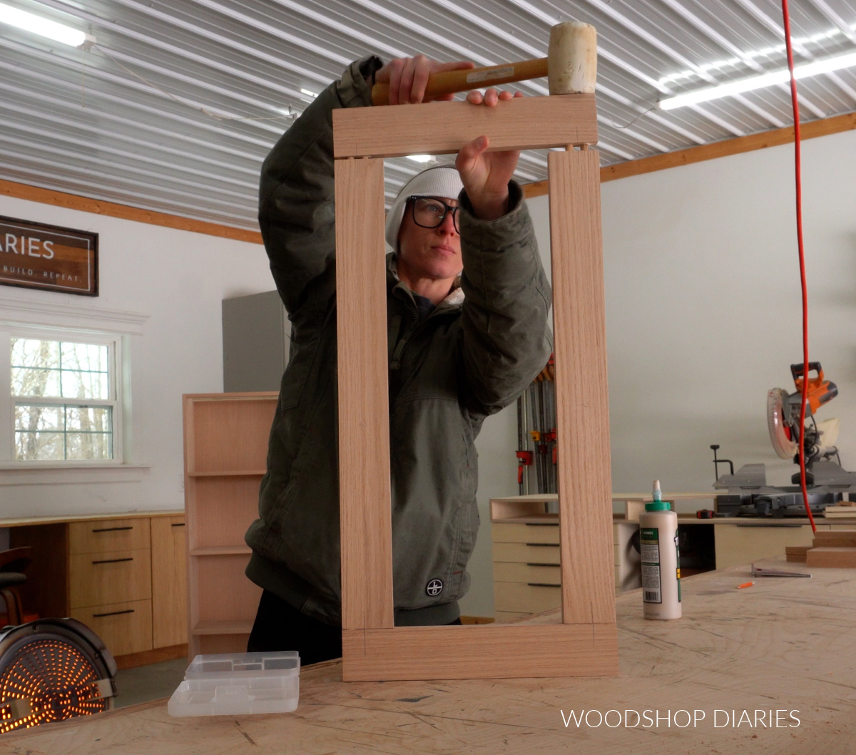 Shara Woodshop Diaries assembling a door frame using dowels on workbench