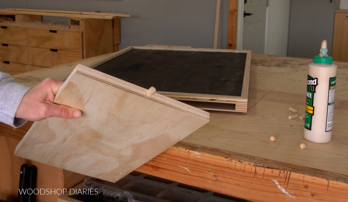 dowel peg glued into puzzle board drawer as a knob