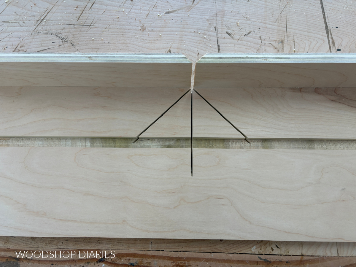 zero degrees and 45 degrees cut into miter saw small parts jig at center