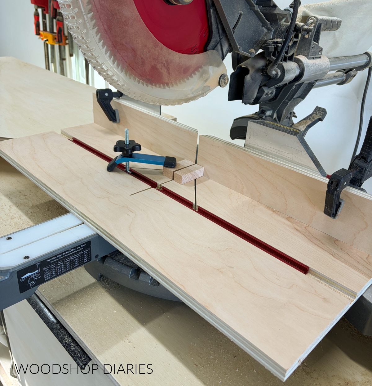 small parts cutting jig clamped to miter saw
