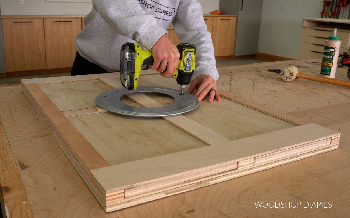 Shara Woodshop Diaries securing lazy susan to bottom of puzzle board