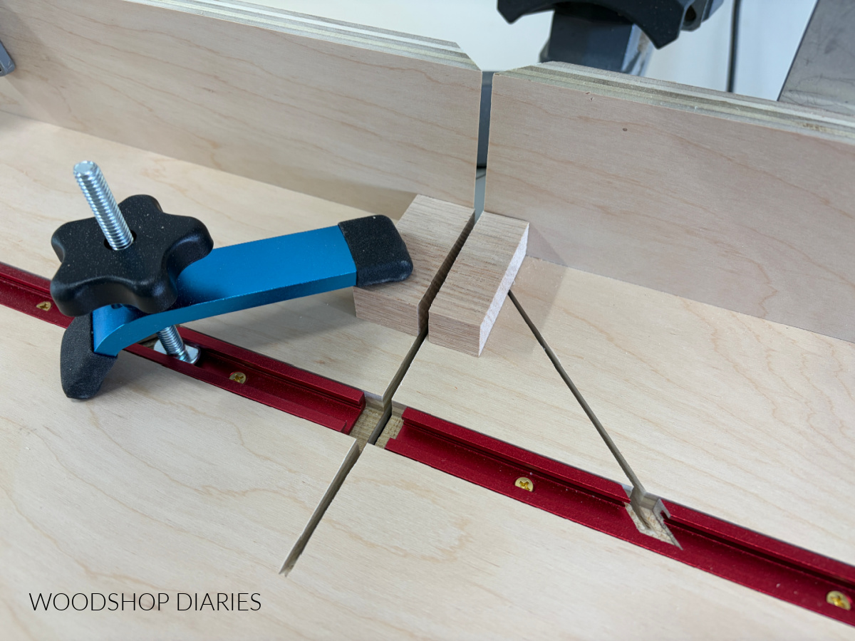 Close up of small piece cut on miter saw with DIY small parts jig