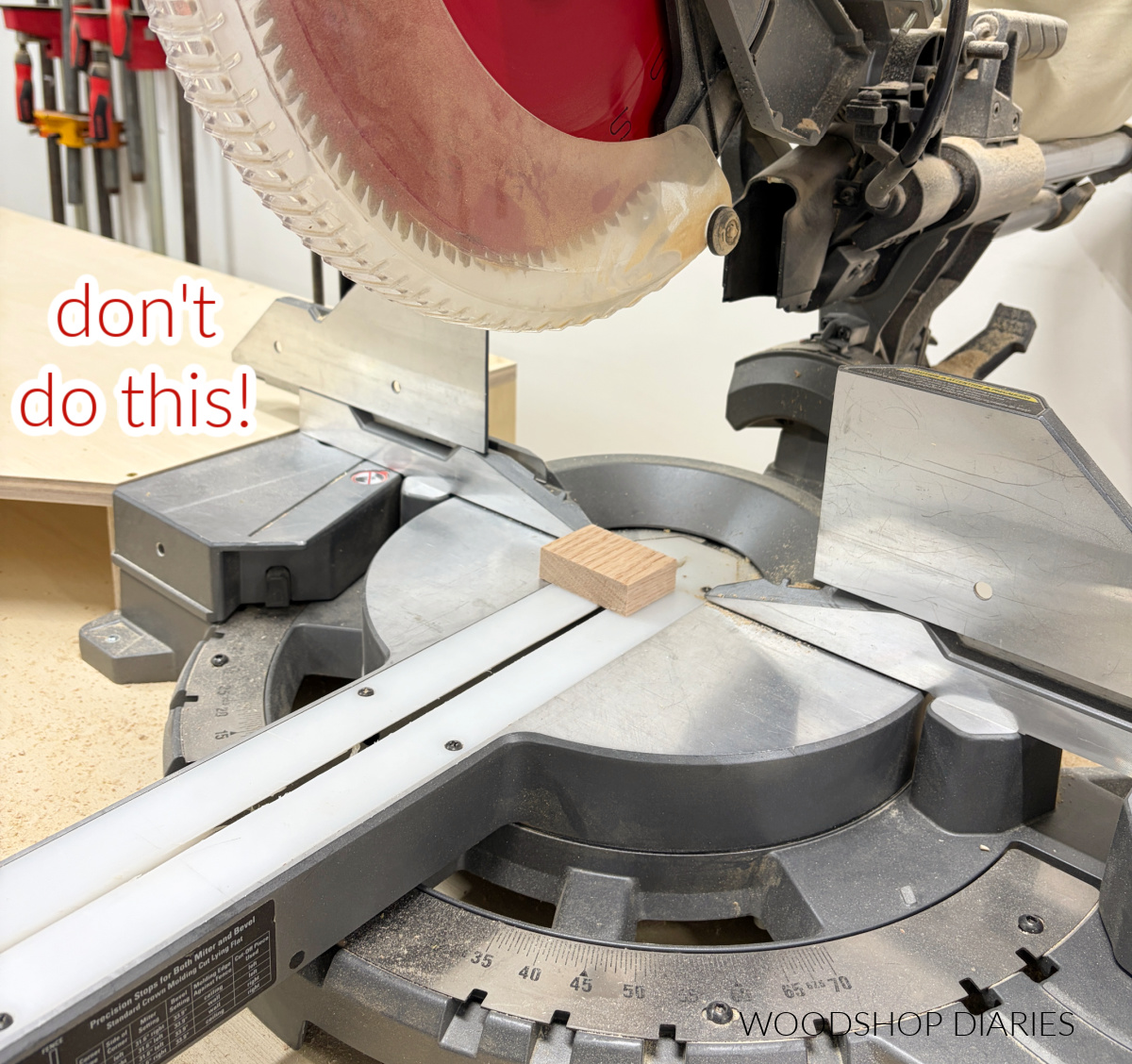 miter saw with small piece ready to cut