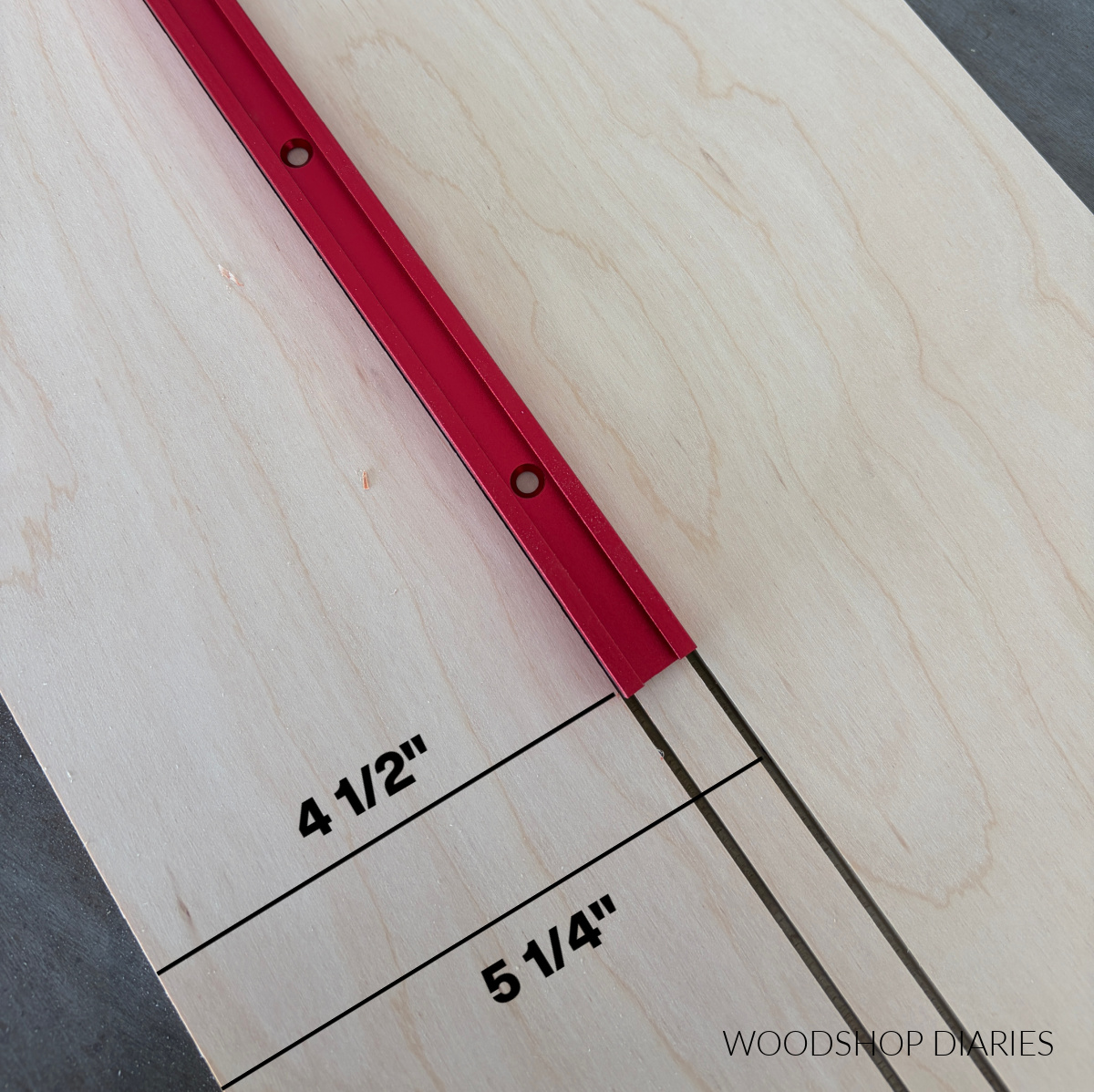 Close up of blade kerfs cut in plywood to fit t track pieces