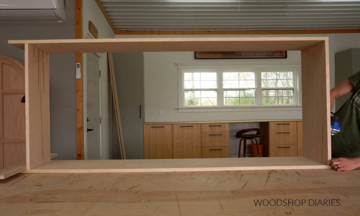 Shara Woodshop Diaries assembling bookcase body on workbench using pocket hole screws