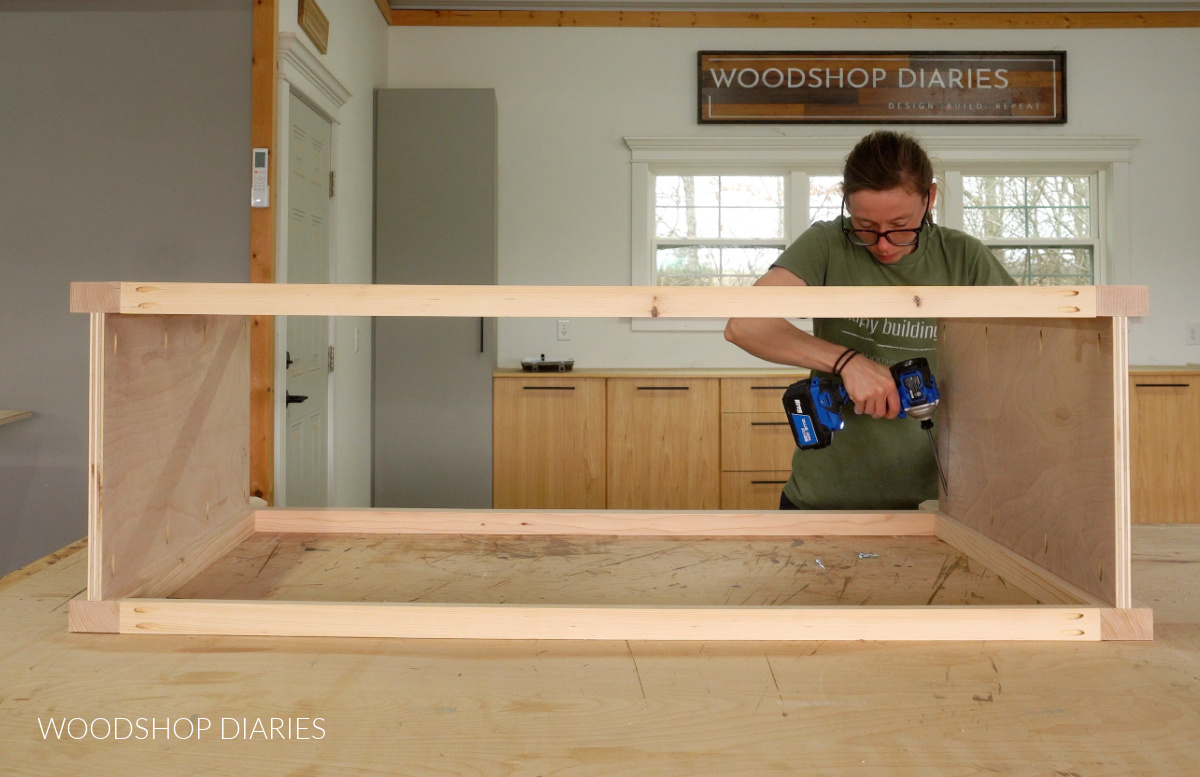 Shara Woodshop Diaries assembling  buffet table cabinet on workbench with pocket hole screws