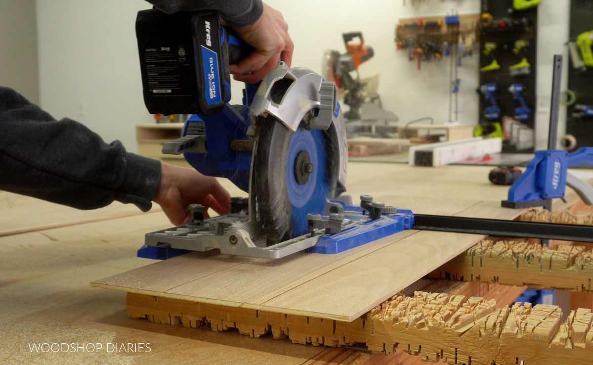 Close up Shara Woodshop Diaries cutting kerfs in door panels to fake shiplap pattern
