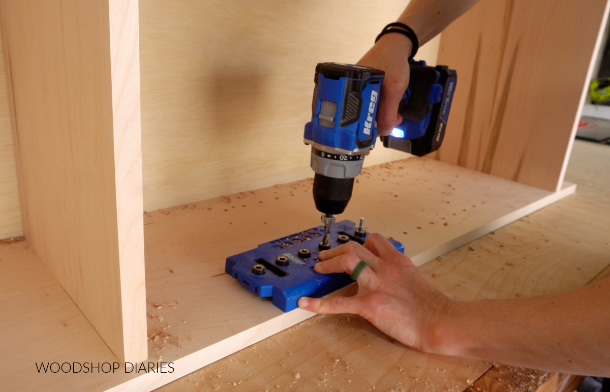 Close up of drilling shelf pin holes for adjustable shelves in bookcase