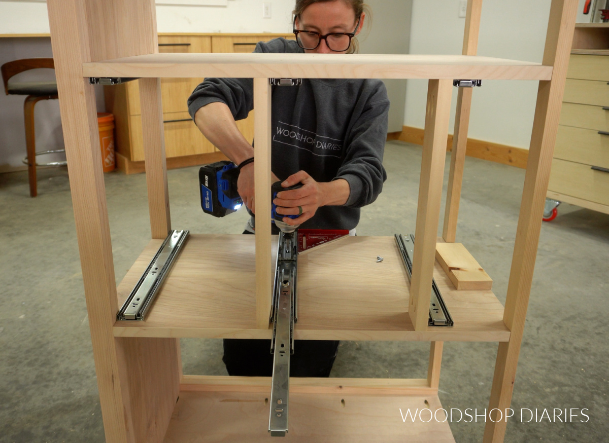 Shara Woodshop Diaries installing drawer slides into center section of buffet cabinet
