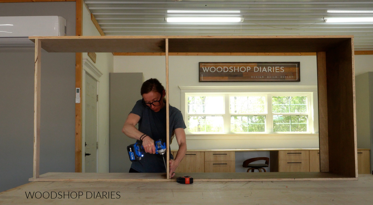 Shara Woodshop Diaries assembling large closet cabinet box using pocket holes on workbench in workshop