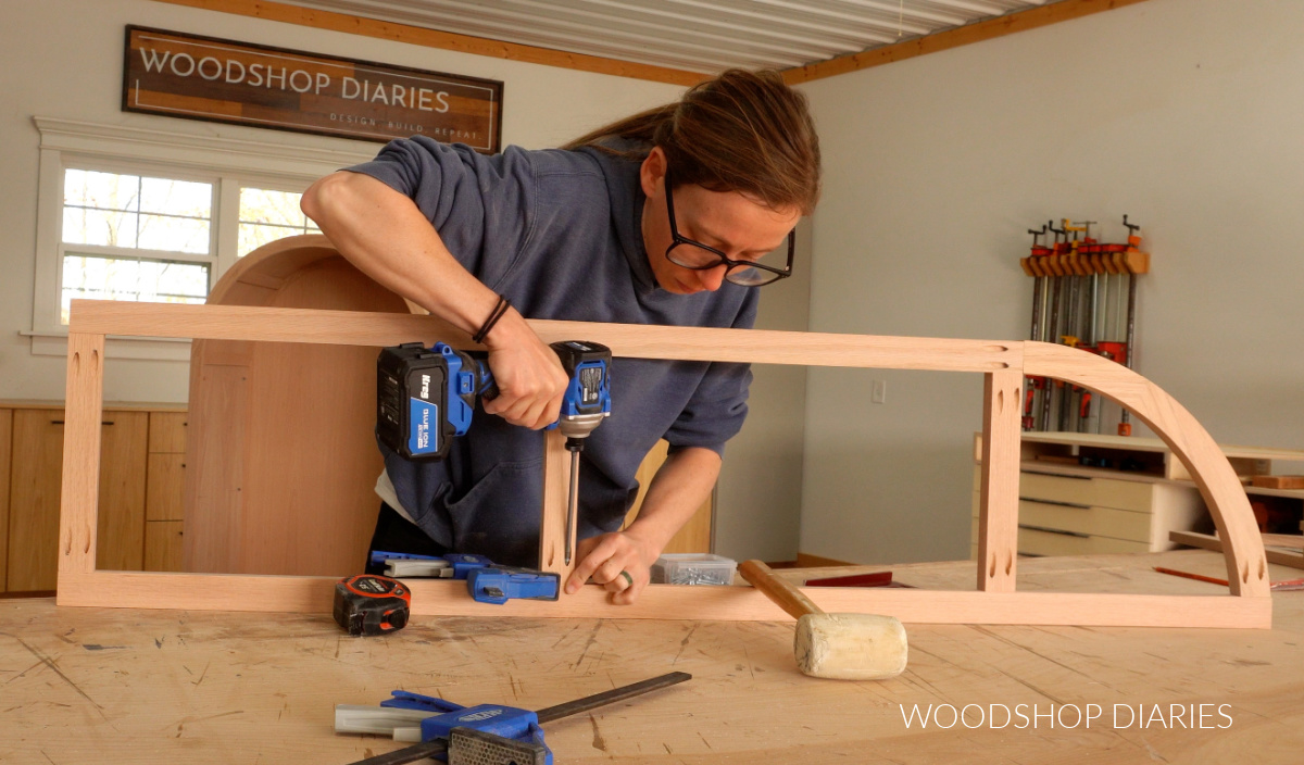 Shara Woodshop Diaries assembling arched door frame using pocket holes and screws on workbench
