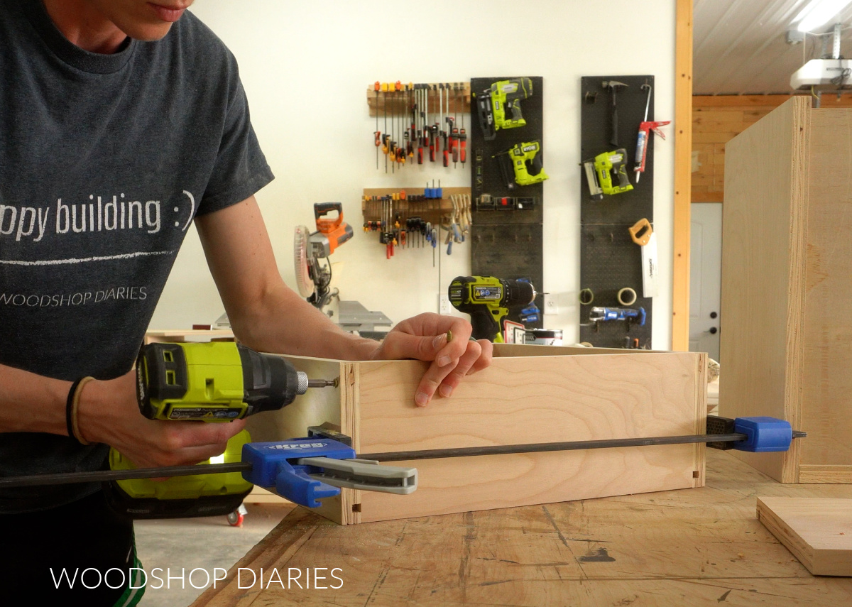 Shara Woodshop Diaries assembling drawer box on workbench with screws