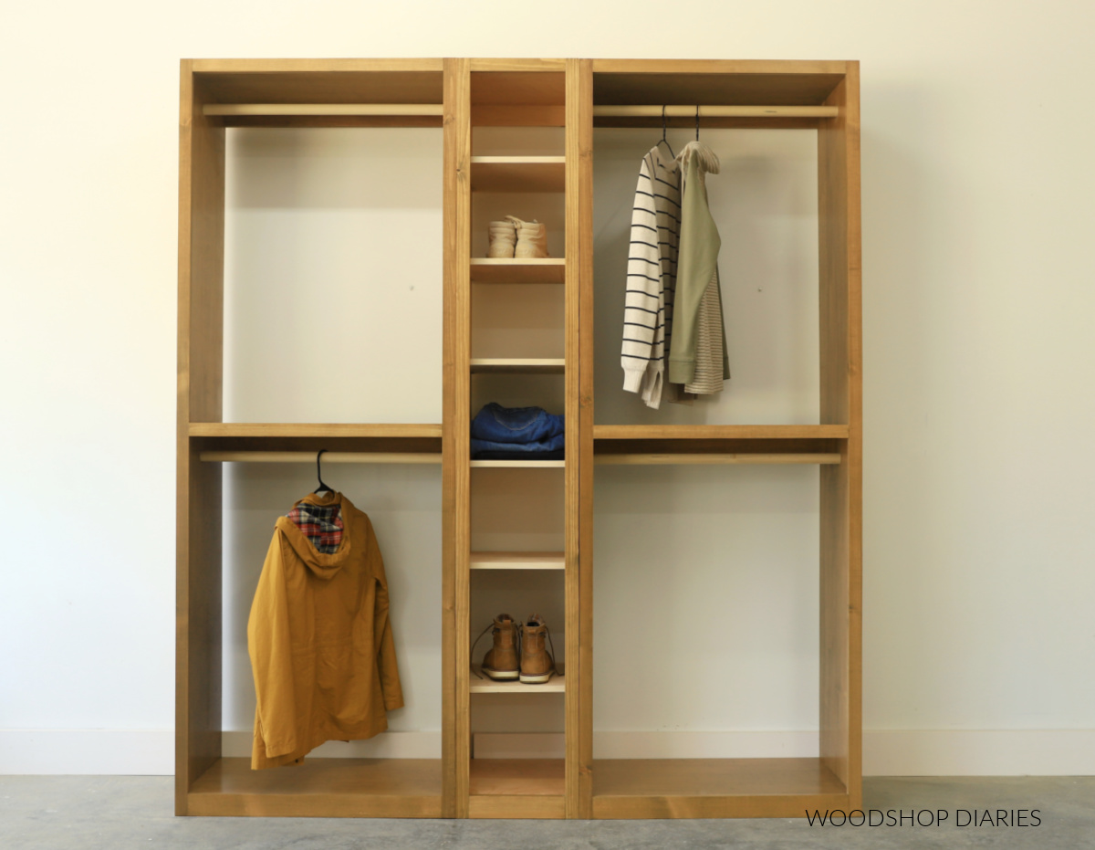 DIY closet tower cabinets with hanging rods on each side and adjustable shoe shelf in the middle