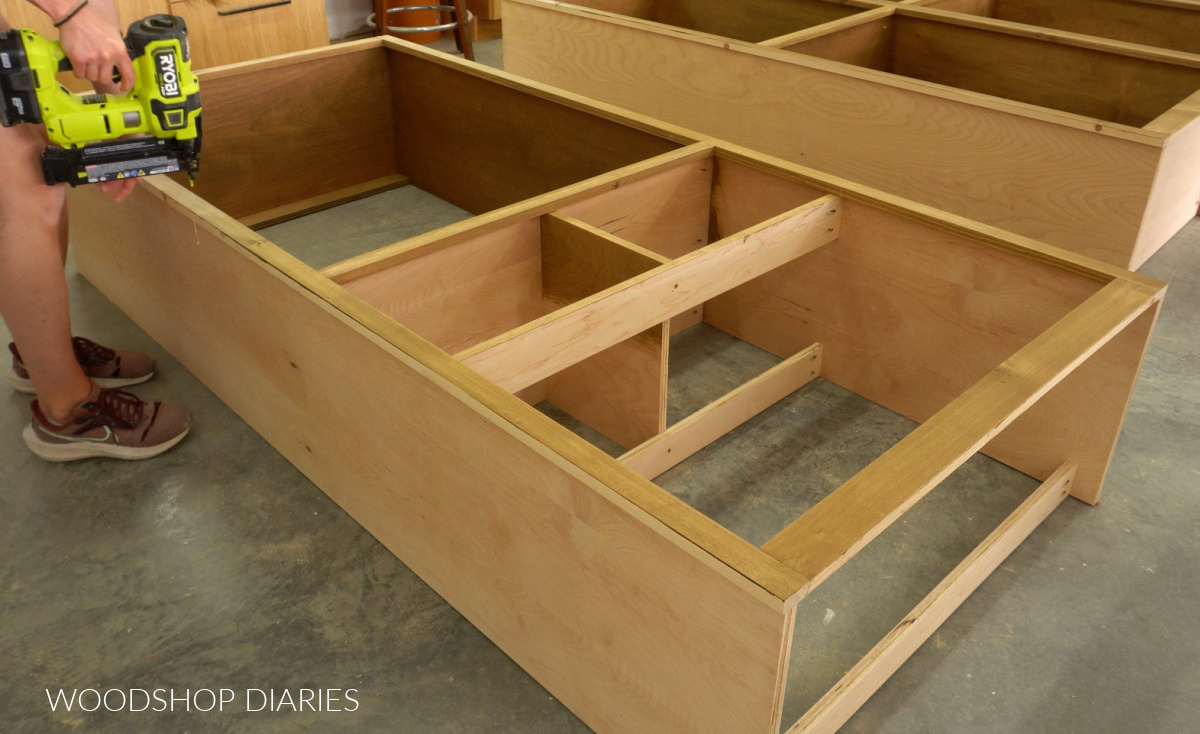 Shara Woodshop Diaries brad nailing face frame onto closet tower cabinet