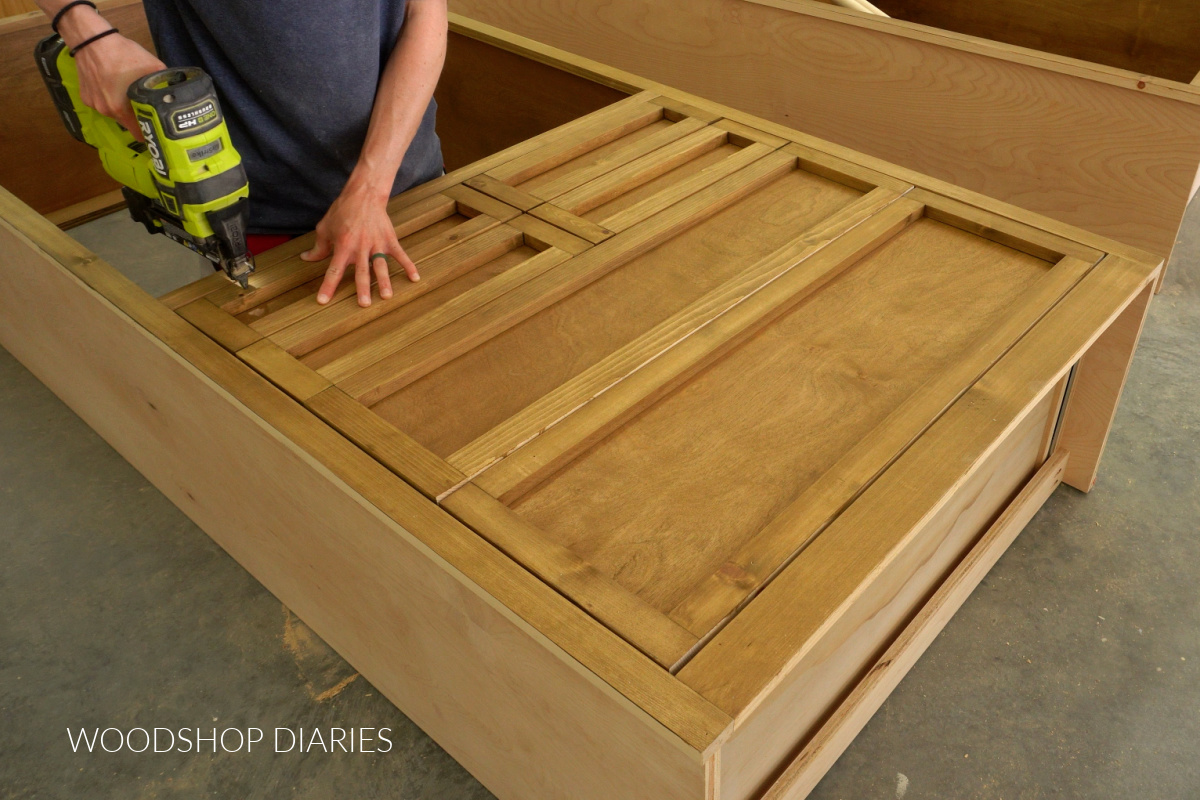 Shara Woodshop Diaries nailing drawer fronts onto drawer boxes in large DIY closet tower cabinet