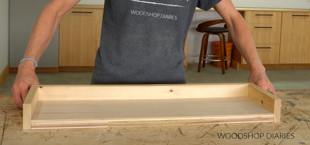 Shara Woodshop Diaries test fitting pieces together to build floating shelf box